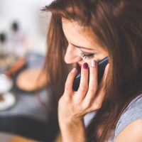 closeup-portrait-of-young-lady-talking-on-mobile-phone-6386